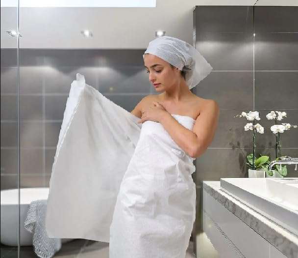 KUDIZE Disposable Non-Woven Water Absorbent, Bath, Face and Body Towel for Travel, Spa, Parlor, Massage, Makeup Removal, Beauty, Hair & Home Care (Size 25 * 50 Inches, Pack of 100) 1