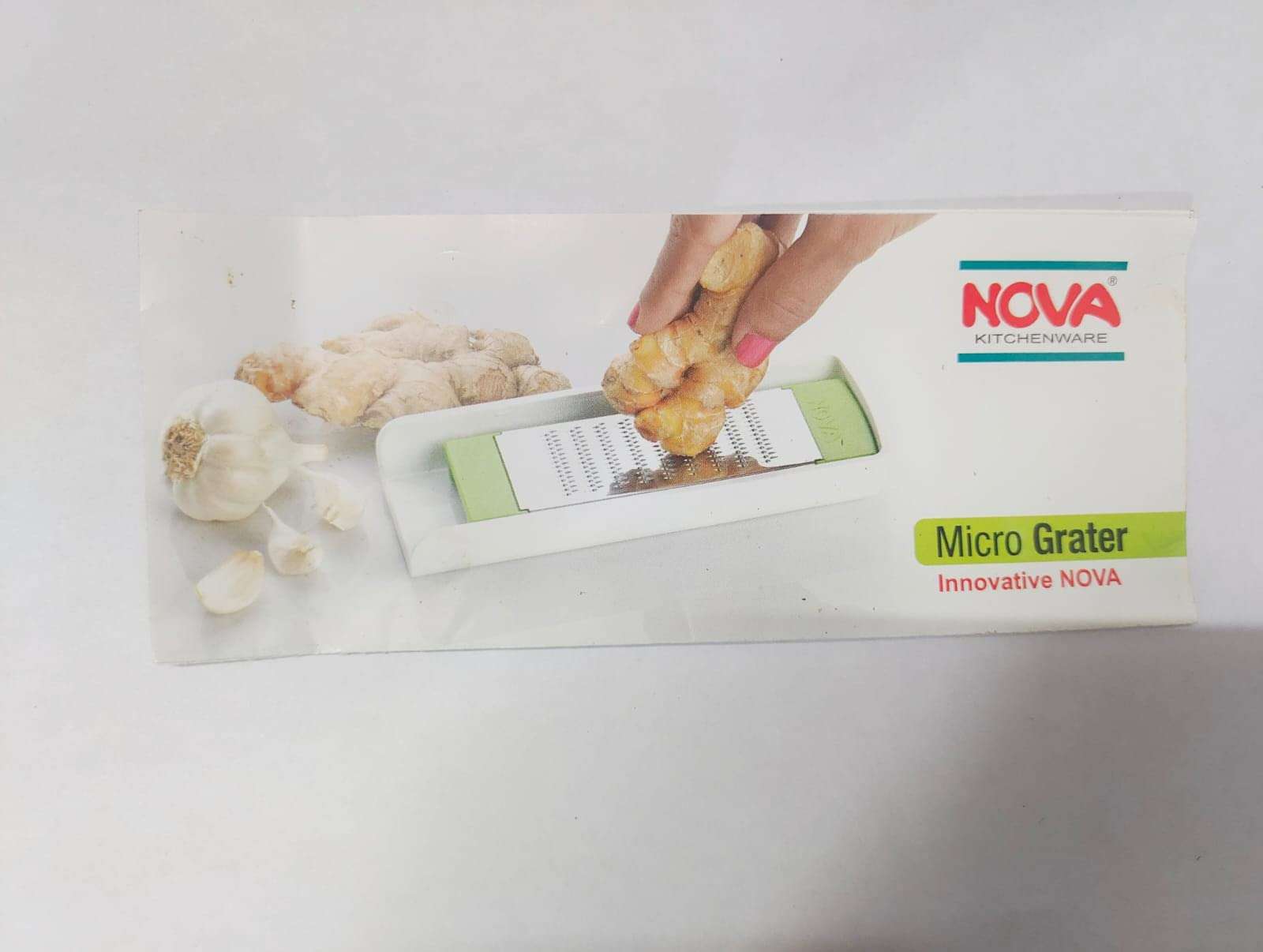 Nova Brand Kitchenware Plastic Micro Grater Used for Nut , Apple, Garlic , Ginger Root , Spices, Coconuts , Carrots ,Cheese Grater, Fruits & Vegetable Grating (Standard Size, Multicolour) 5