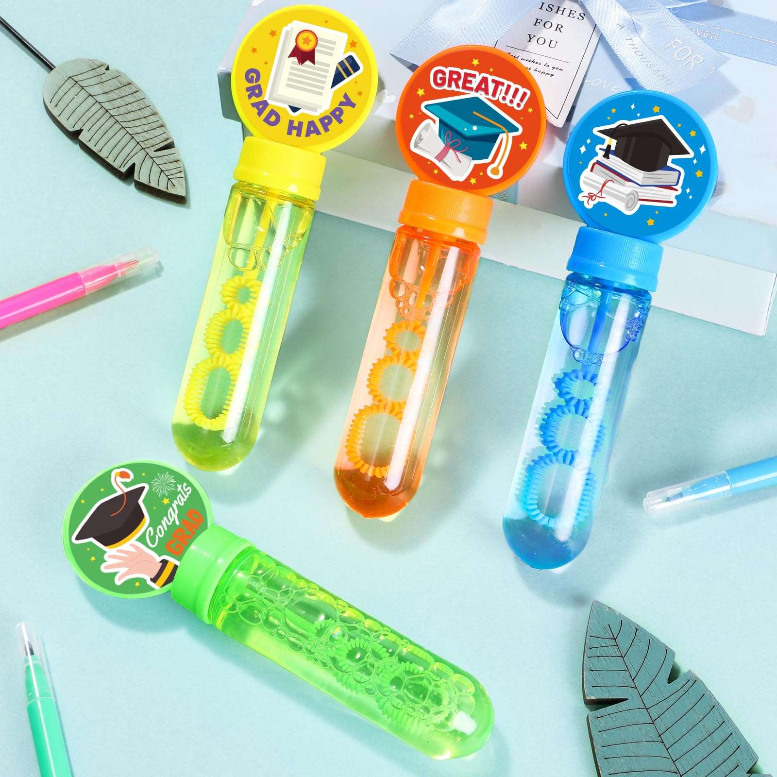 KELENO 24 Graduation Party Favors Mini Bubbles Birthday Supplies Bubble Wands Bulk Adults Prize Goodie Bag Stuffers Preschool Kindergarten Grad Toy Gift Class Bubble Party Favors for Kids 3-5 4-8 4